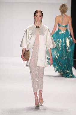 Model walks runway wearing Giada Curti