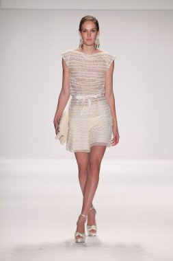 Model walks runway wearing Giada Curti