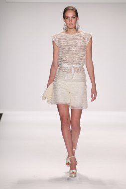 Model walks runway wearing Giada Curti