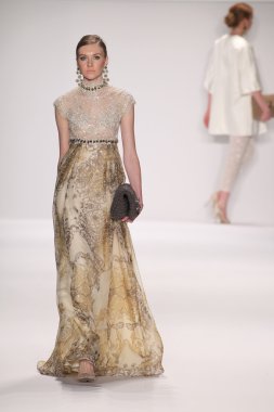 Model walks runway wearing Giada Curti