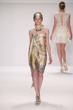 Model walks runway wearing Giada Curti