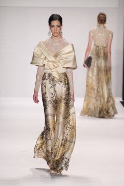 Model walks runway wearing Giada Curti