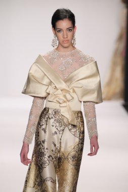 Model walks runway wearing Giada Curti