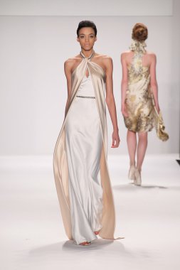 Model walks runway wearing Giada Curti