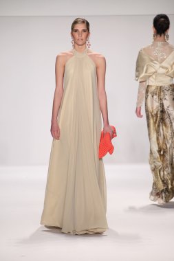 Model walks runway wearing Giada Curti