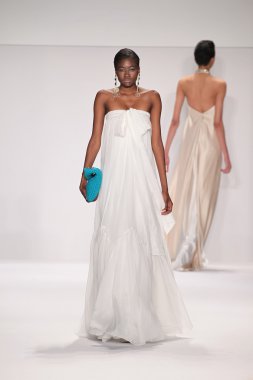 Model walks runway wearing Giada Curti