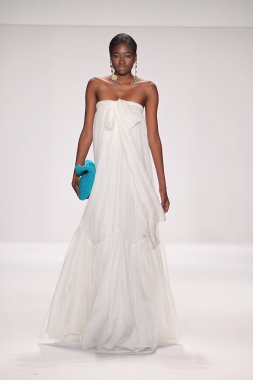 Model walks runway wearing Giada Curti