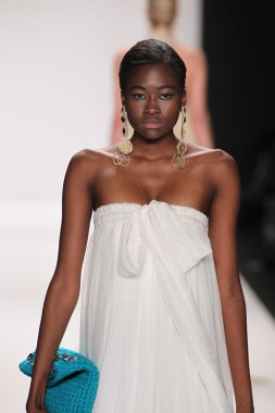 Model walks runway wearing Giada Curti