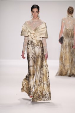 Model walks runway wearing Giada Curti