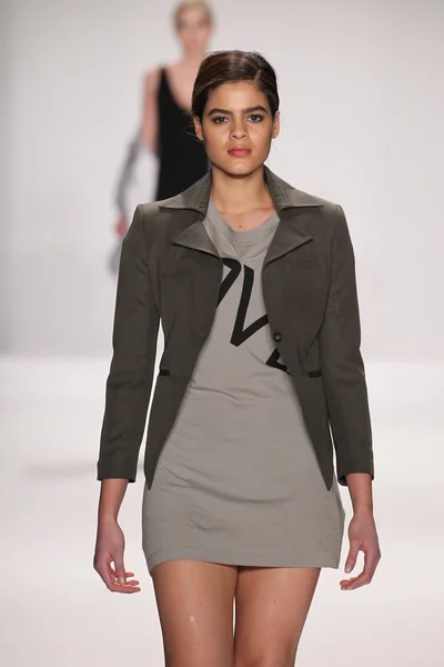 Model walks runway wearing M The Movement — Stock Photo, Image