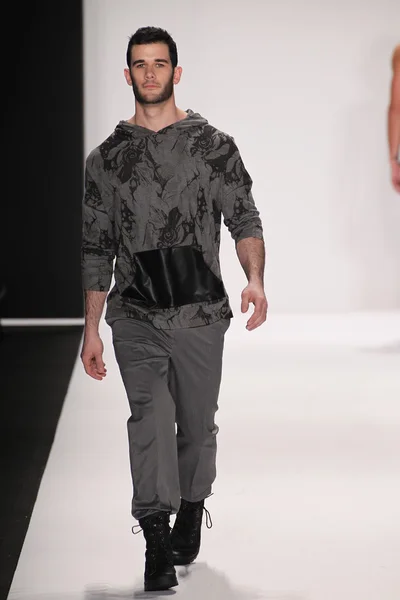 Model walks the runway wearing Mister Triple X — Stock Photo, Image