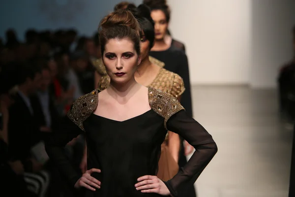 Model walks runway at Naveda Couture show Royalty Free Stock Images