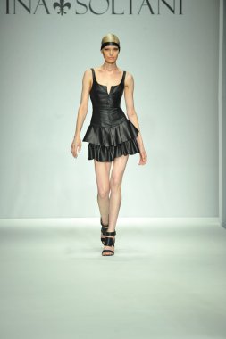 Model walks runway at Ina Soltani clipart