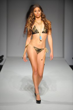 Model at Miss Kinsman Swim show clipart