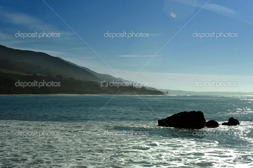 Oceanside beach and rocks Stock Photo by ©fashionstock 43563951