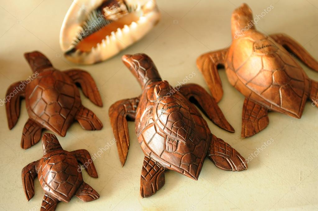 Souvenir wooden turtles and shell — Stock Photo © fashionstock 46482555
