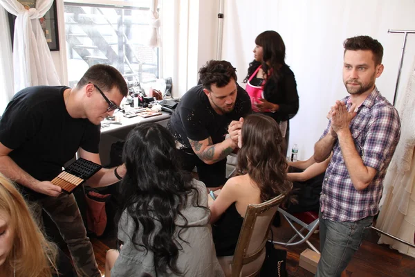 Hair stylist getting model ready backstage — Stock Photo, Image
