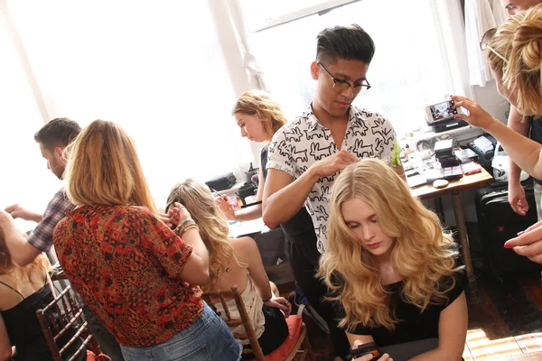 Hair stylist getting model ready backstage — Stock Photo, Image