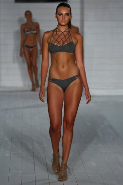Model walks at San Lorenzo Swimwear collection during MBFW Miami Swim clipart