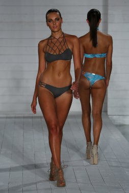 Model walks at San Lorenzo Swimwear collection clipart