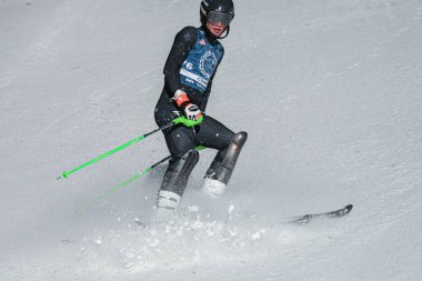 VERMONT - DECEMBER, 17: Young skiers from Mount Mansfield Academy practising on Spruce Peak Race Course Stowe Mountain Resort on December 17, 2021 in Stowe, VT, USA.