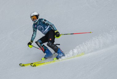 VERMONT - DECEMBER, 17: Young skiers from Mount Mansfield Academy practising on Spruce Peak Race Course Stowe Mountain Resort on December 17, 2021 in Stowe, VT, USA.