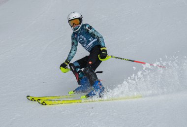 VERMONT - DECEMBER, 17: Young skiers from Mount Mansfield Academy practising on Spruce Peak Race Course Stowe Mountain Resort on December 17, 2021 in Stowe, VT, USA.