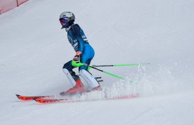 VERMONT - DECEMBER, 17: Young skiers from Mount Mansfield Academy practising on Spruce Peak Race Course Stowe Mountain Resort on December 17, 2021 in Stowe, VT, USA.