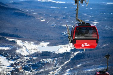 Easy way Gondola lift at Stowe Ski Resort in Vermont, view to the Spruce Peak village.