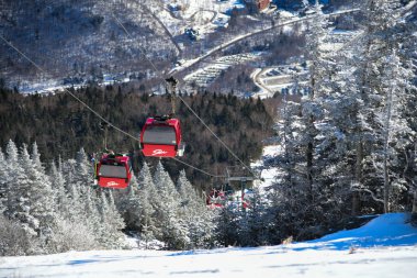 Easy way Gondola lift at Stowe Ski Resort in Vermont, view to the Spruce Peak village, December winter season in VT.
