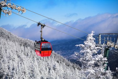 Stowe mountain ski resort gondola, Vermont USA. Winter landscape with pine trees covered with snow.