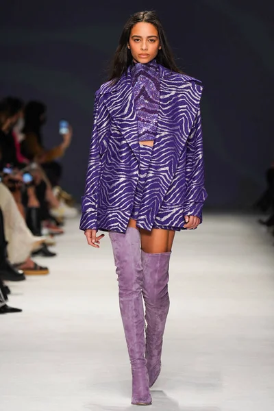MILAN, ITALY - FEBRUARY 24: A model walks the runway at the Genny fashion show during the Milan Fashion Week Fall/Winter 2022/2023 on February 24, 2022 in Milan, Italy.