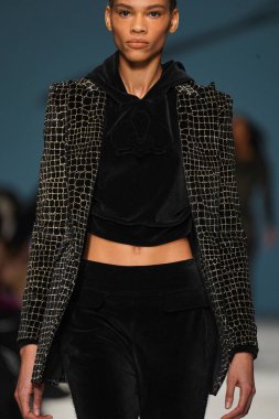 MILAN, ITALY - FEBRUARY 24: A model walks the runway at the Genny fashion show during the Milan Fashion Week Fall/Winter 2022/2023 on February 24, 2022 in Milan, Italy.