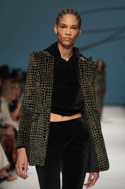MILAN, ITALY - FEBRUARY 24: A model walks the runway at the Genny fashion show during the Milan Fashion Week Fall/Winter 2022/2023 on February 24, 2022 in Milan, Italy.
