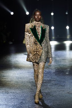 MILAN, ITALY - FEBRUARY 23: Adut Akech walks the runway at the Roberto Cavalli fashion show during the Milan Fashion Week Fall/Winter 2022/2023 on February 23, 2022 in Milan, Italy.
