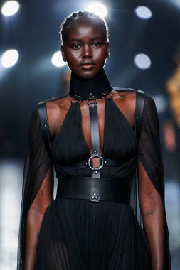MILAN, ITALY - FEBRUARY 23: Adut Akech walks the runway at the Roberto Cavalli fashion show during the Milan Fashion Week Fall/Winter 2022/2023 on February 23, 2022 in Milan, Italy.