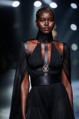 MILAN, ITALY - FEBRUARY 23: Adut Akech walks the runway at the Roberto Cavalli fashion show during the Milan Fashion Week Fall/Winter 2022/2023 on February 23, 2022 in Milan, Italy.