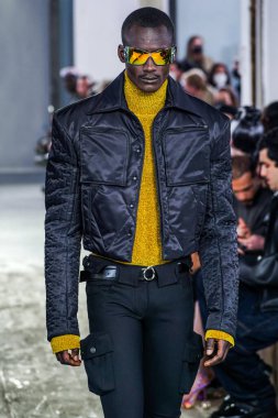 MILAN, ITALY - FEBRUARY 26: A model walks the runway at the Trussardi fashion show during the Milan Fashion Week Fall/Winter 2022/2023 on February 26, 2022 in Milan, Italy.