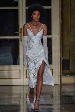 MILAN, ITALY - FEBRUARY 26: A model walks the runway at the Ermanno Scervino fashion show during the Milan Fashion Week Fall/Winter 2022/2023 on February 26, 2022 in Milan, Italy.