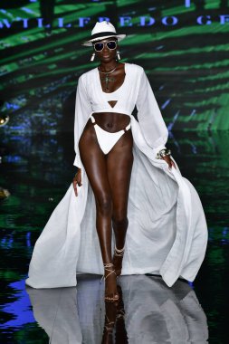 MIAMI BEACH, FLORIDA - JULY 09: A model walks the runway at the Willfredo Gerardo Show during Miami Swim Week Powered By Art Hearts Fashion at Faena Forum on July 09th, 2021 in Miami Beach, Florida.