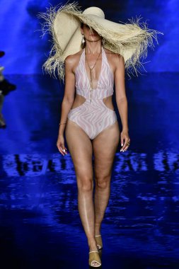 MIAMI BEACH, FLORIDA - JULY 09: A model walks the runway at the Fernando Alberto Atelier Show during Miami Swim Week Powered By Art Hearts Fashion at Faena Forum on July 09th, 2021 in Miami Beach, Florida. 