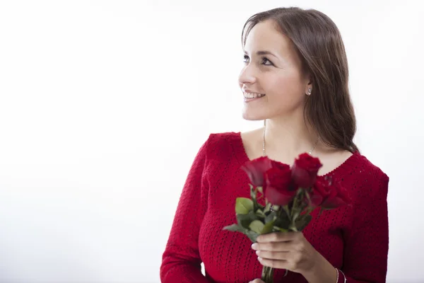 Woman in red sweater holding a rose — Stock Photo, Image