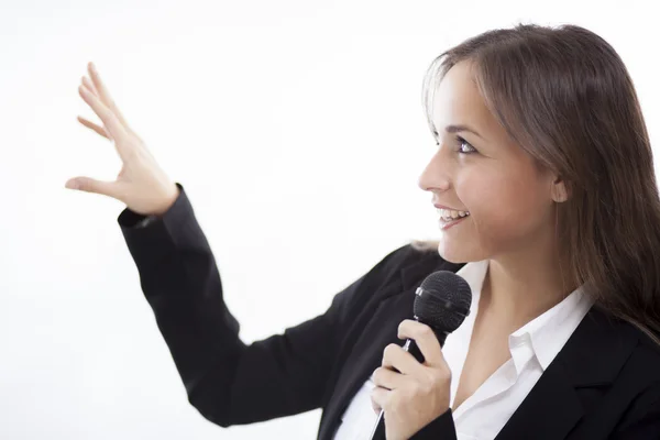 Mulher de negócios segurando microfone — Fotografia de Stock