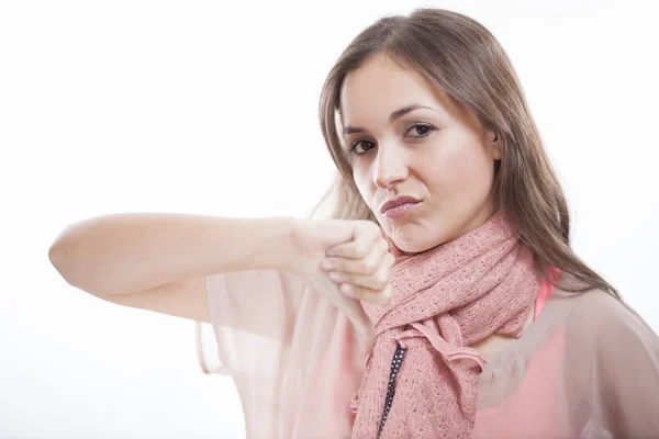 Disappointed young woman giving thumbs down — Stock Photo, Image