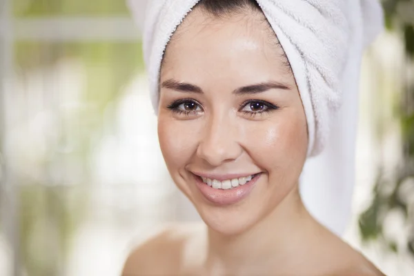 Portrait of beautiful lady with a towel around her head — Stock Photo, Image