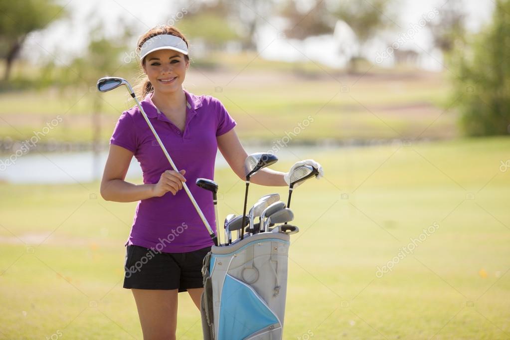 Beautiful girl golf player Stock Photo by ©tonodiaz 24965583