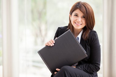 The image of the beautiful business woman with a briefcase