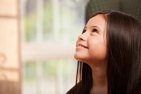 Beautiful little girl looking up — Stock Photo, Image