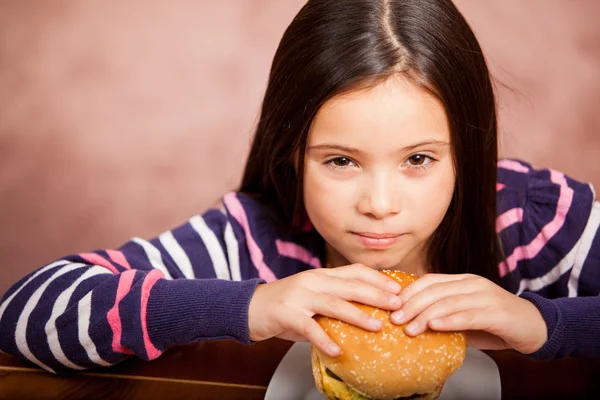 Little girl eating a sandwich — Stock Photo, Image