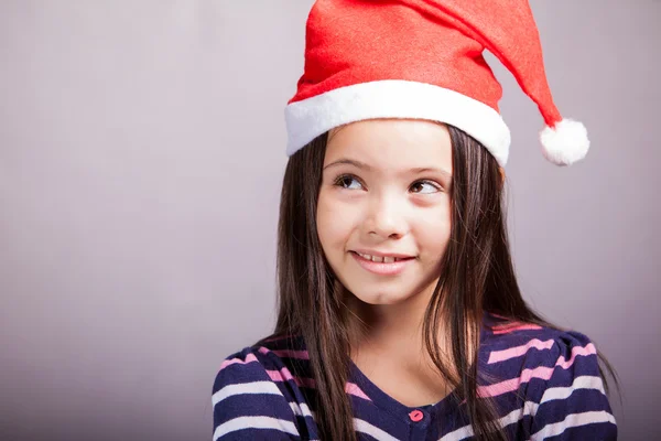 Mooi meisje in Kerstman hoed — Stockfoto